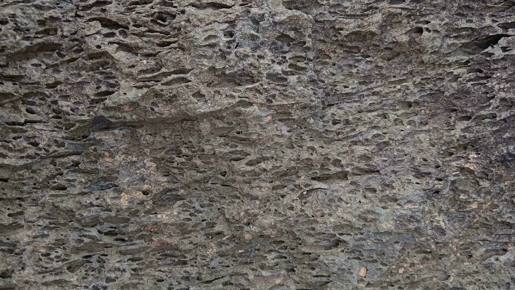 áspero Roca textura para antecedentes foto