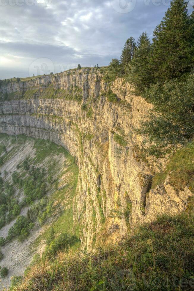 Famous cliff Creux du Van at Neuchatel, Switzerland photo