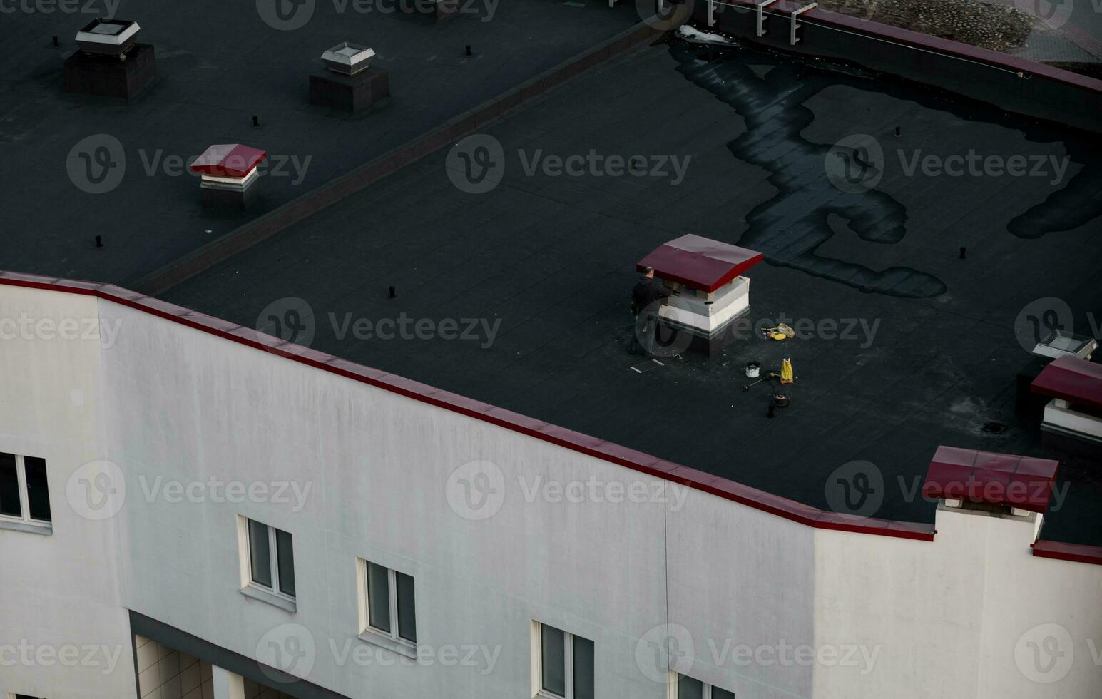 A working plasterer on the roof. photo