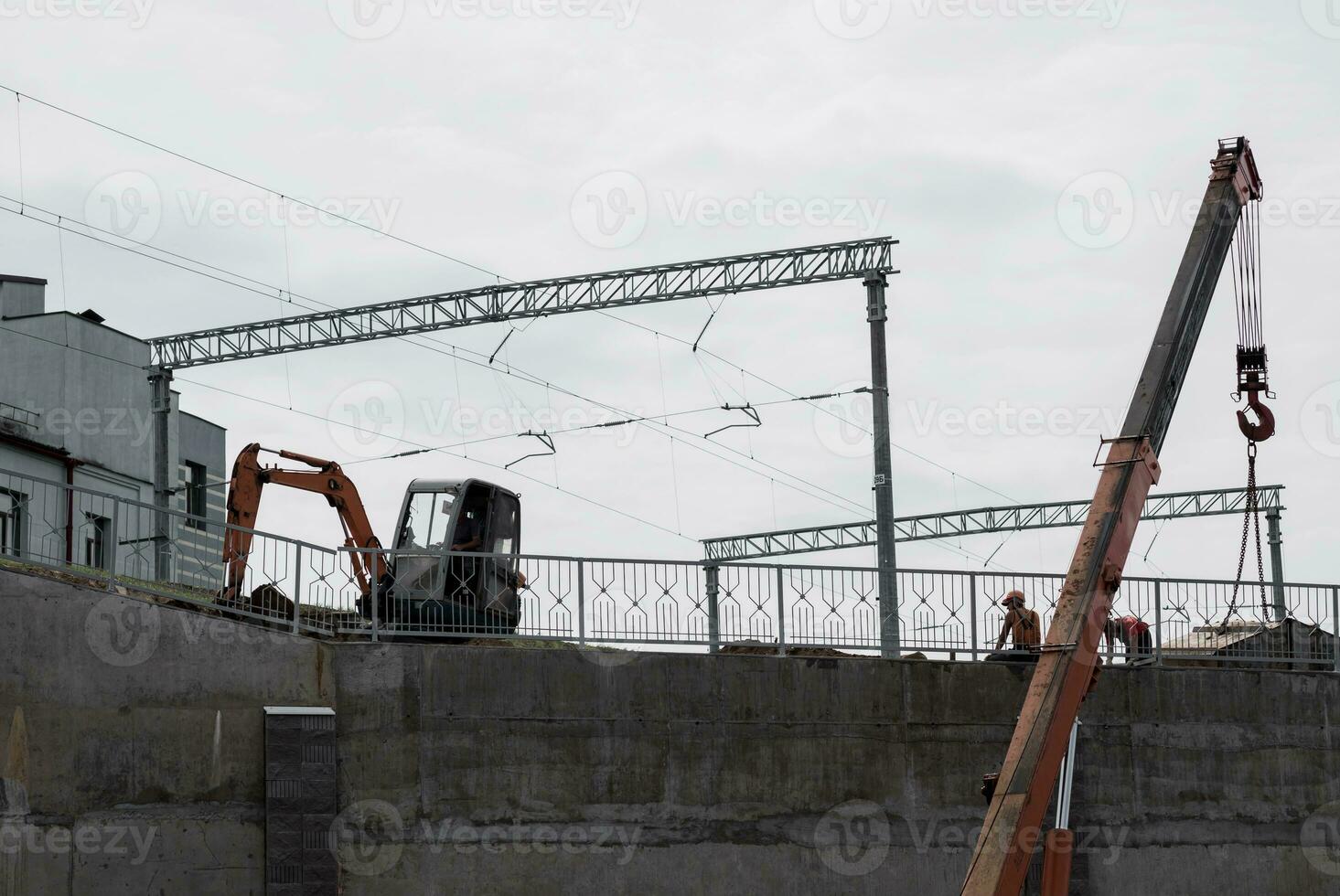 construction site with equator and workers photo