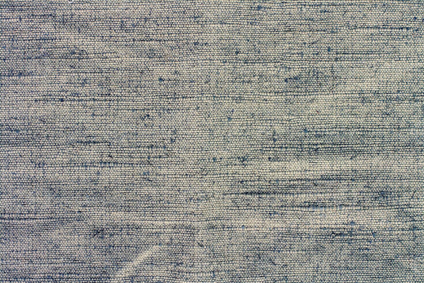 The texture of the fabric with textured stitches. Bulges and bumps in textiles. Yellow tinted. Copy space. photo