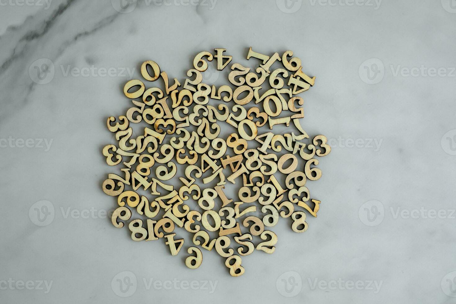 Scattered numbers with a white marble background. photo