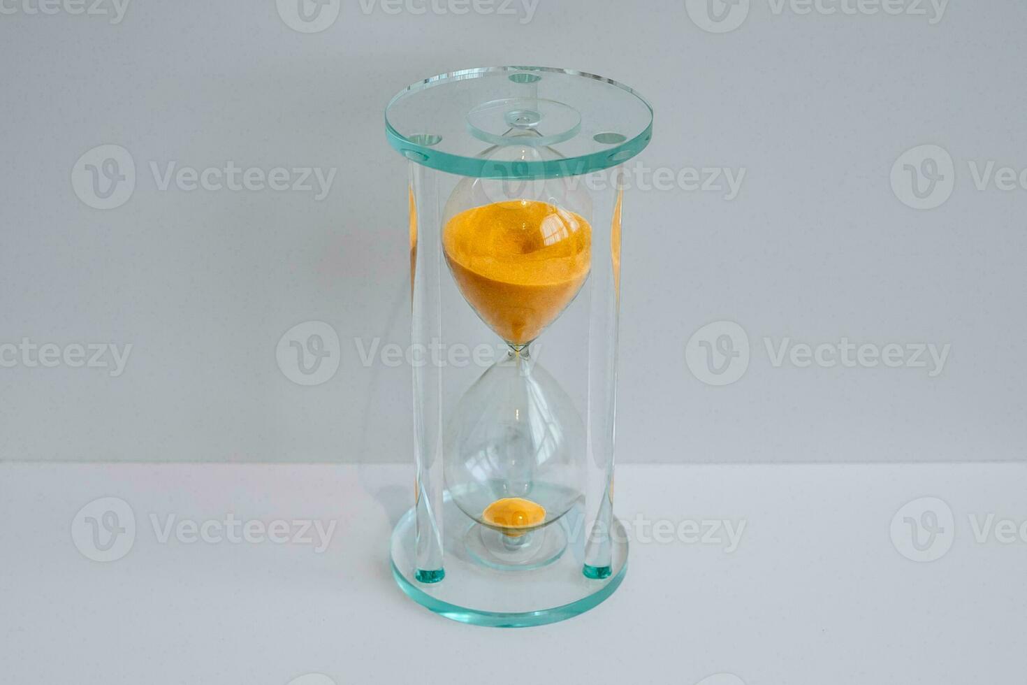 One hourglass with a white background. photo