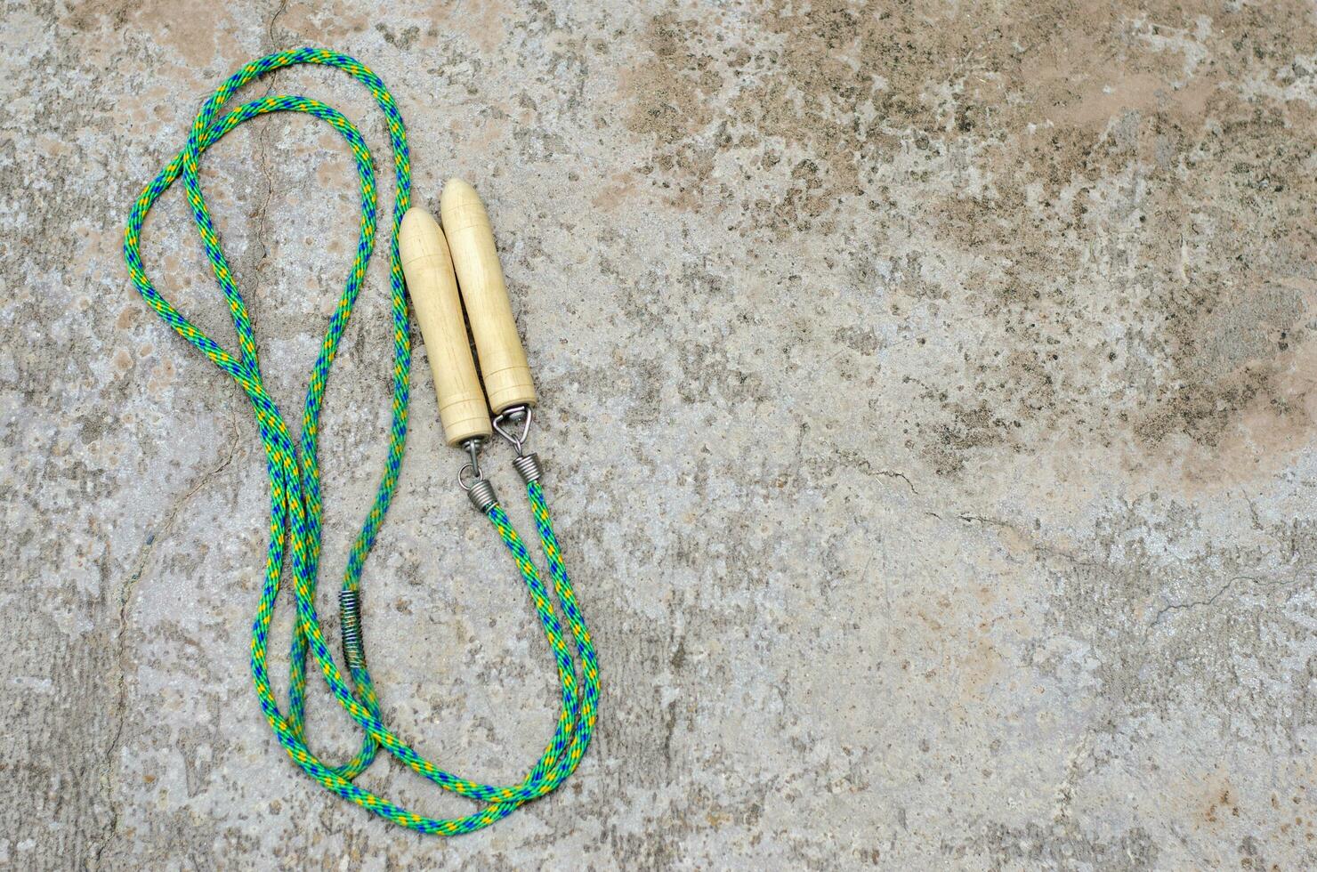 Jumping rope on cement floor background with copy space, Top view, Fitness and health care concept. photo