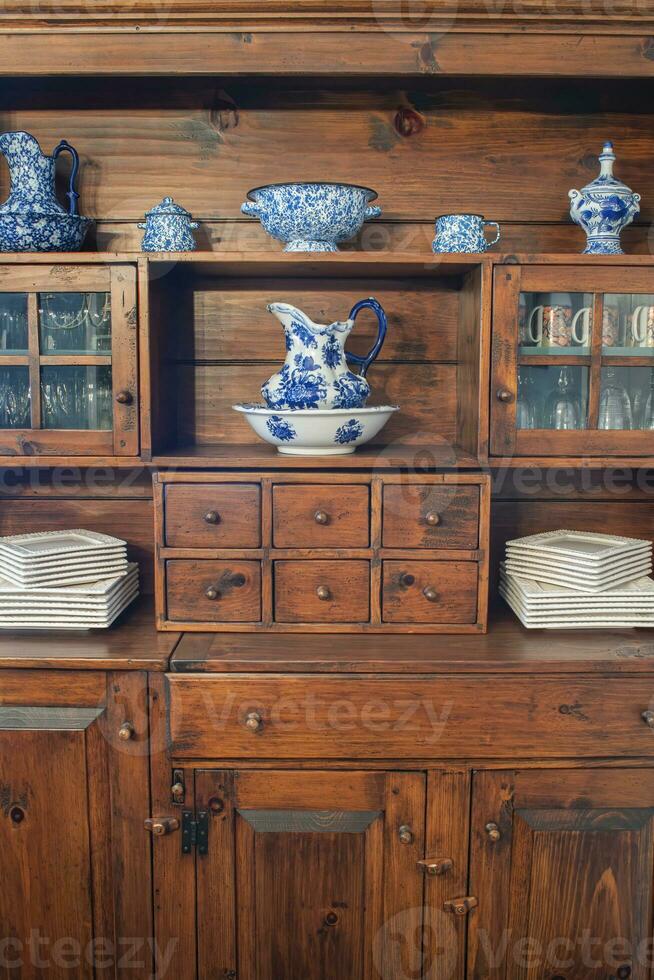 Country Cupboard with Blue and White Dinnerware photo