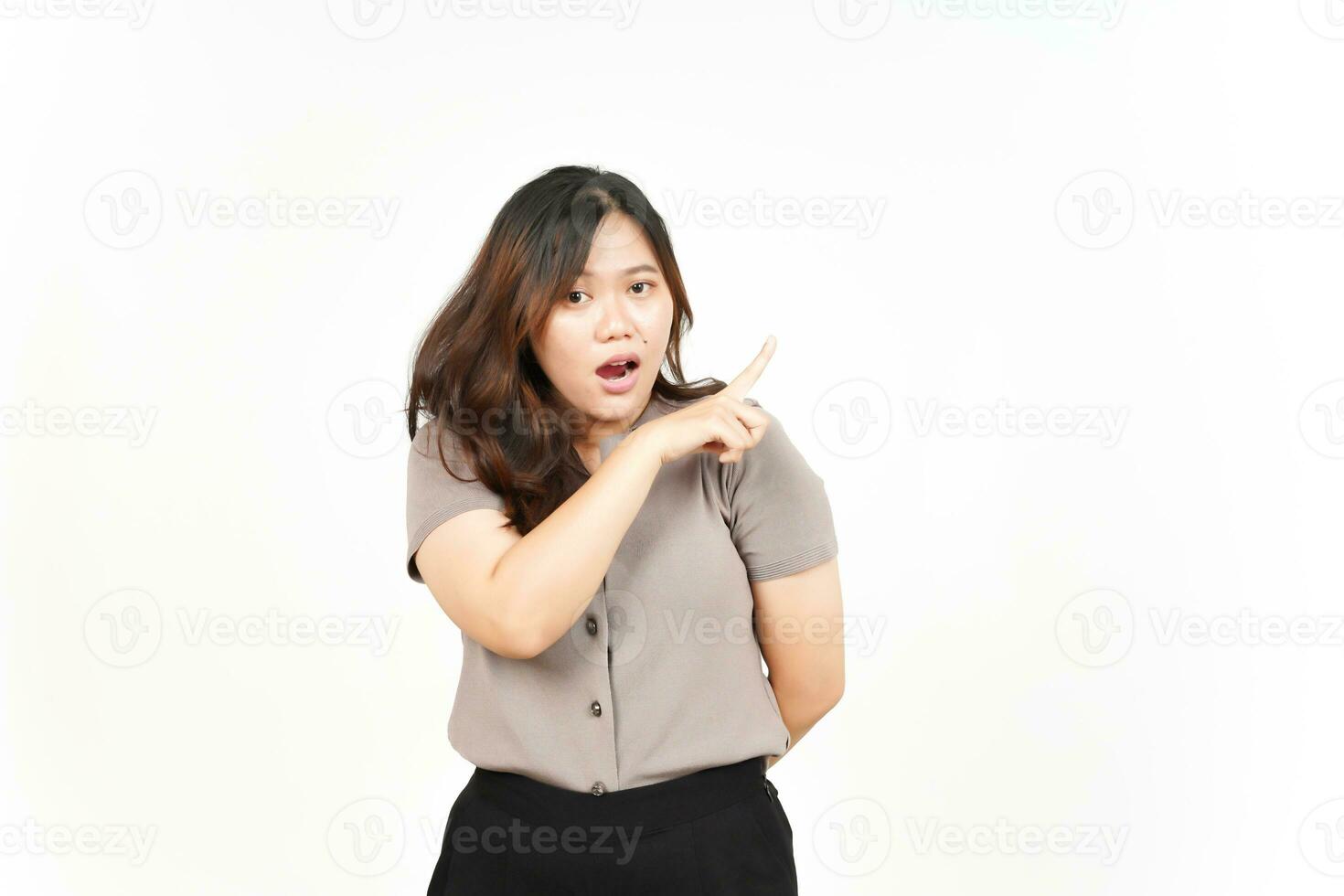 Showing Product and Pointing Side using forefinger Of Beautiful Asian Woman Isolated On White photo