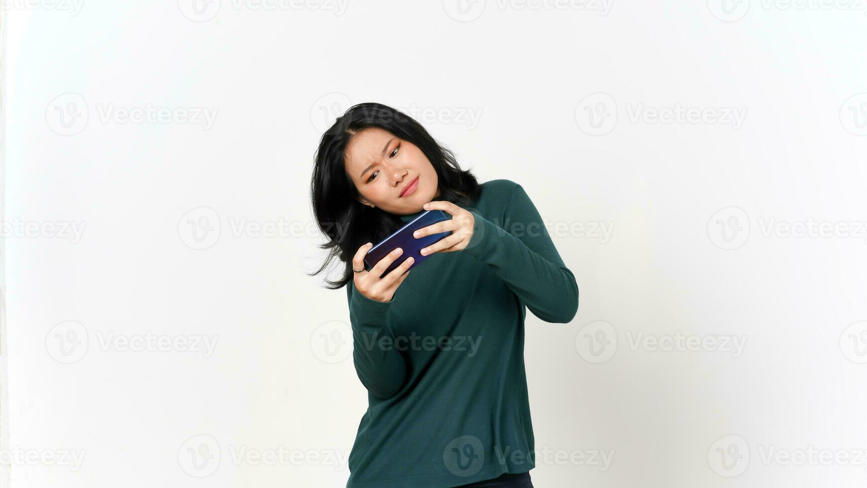 Holding Smartphone and Playing Games on Smartphone Of Beautiful Asian Woman Isolated On White Background photo