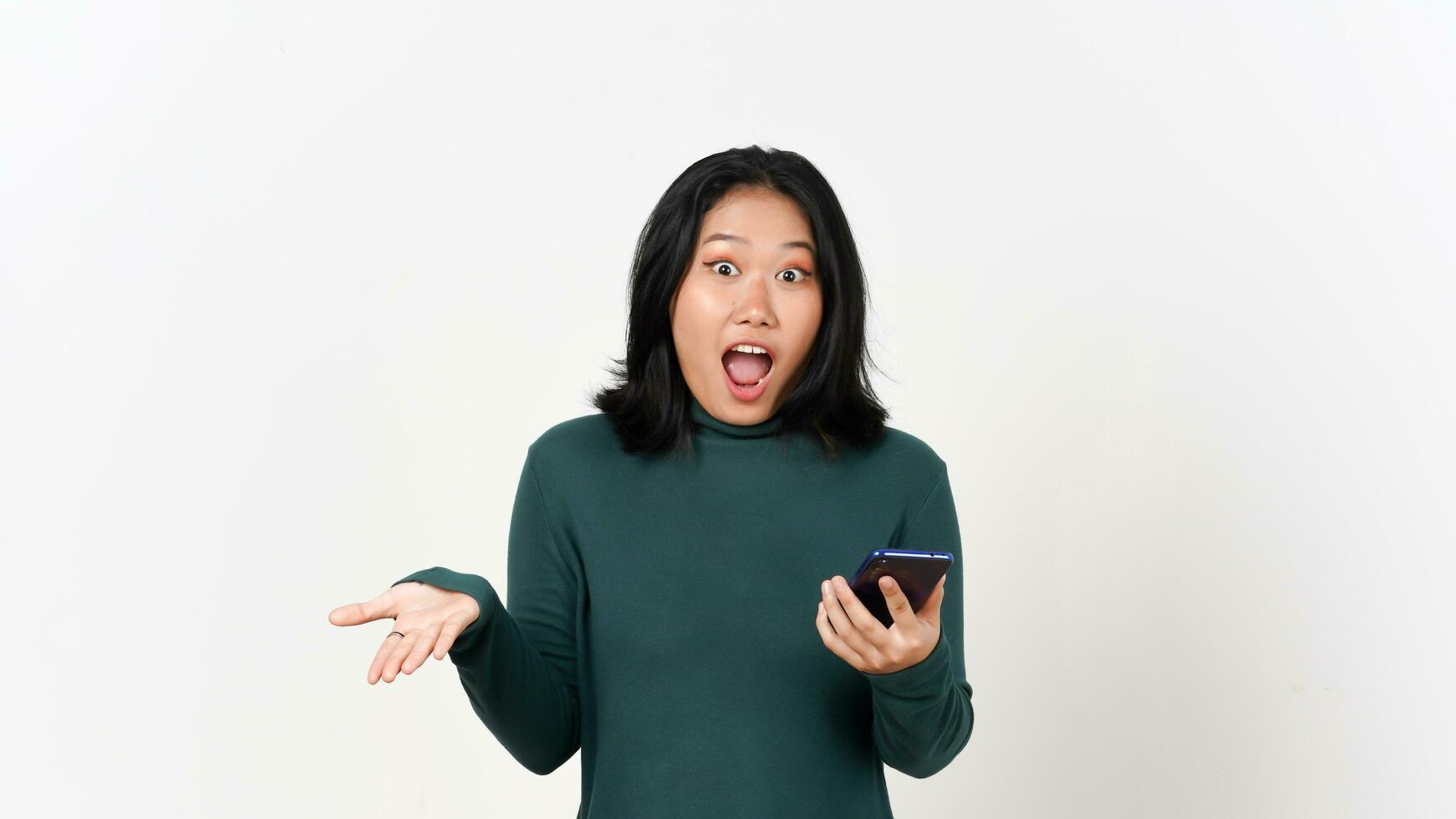 Holding Smartphone Shocked face with don't know gesture Of Beautiful Asian Woman Isolated On White Background photo