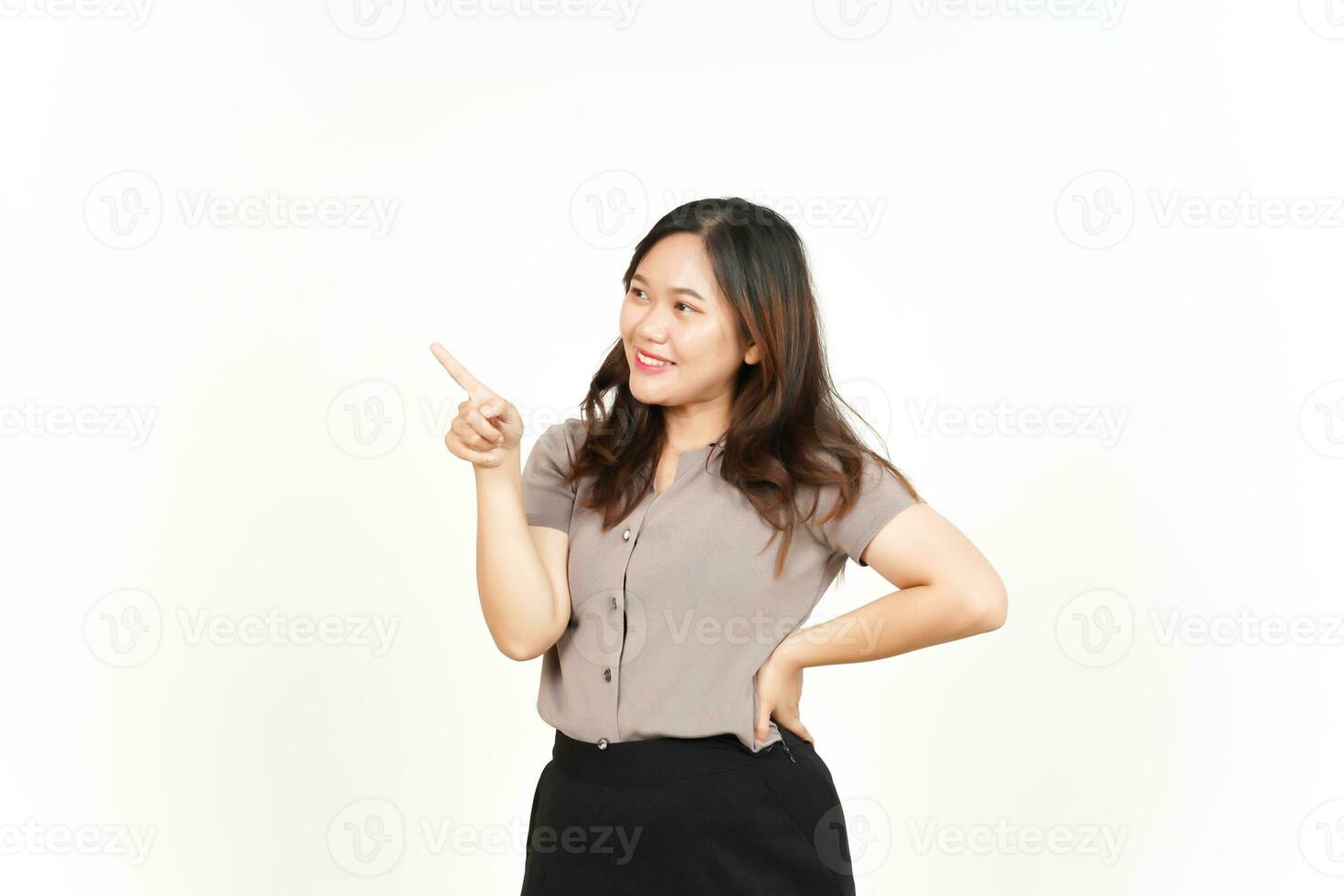 Showing Product and Pointing Side using forefinger Of Beautiful Asian Woman Isolated On White photo
