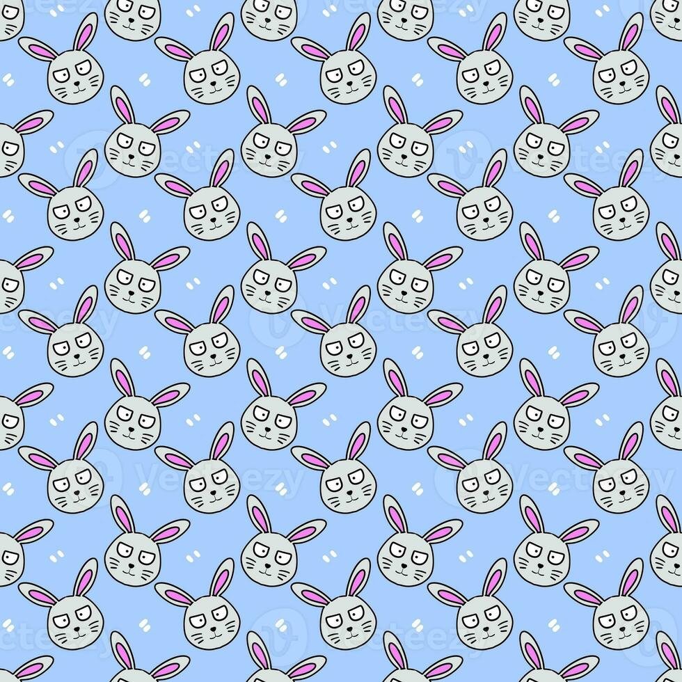 seamless pattern with easter eggs and rabbits on blue background photo