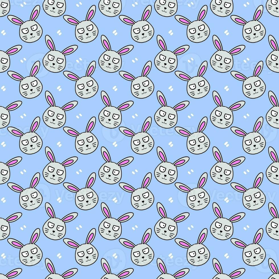 seamless pattern with easter eggs and rabbits on blue background photo