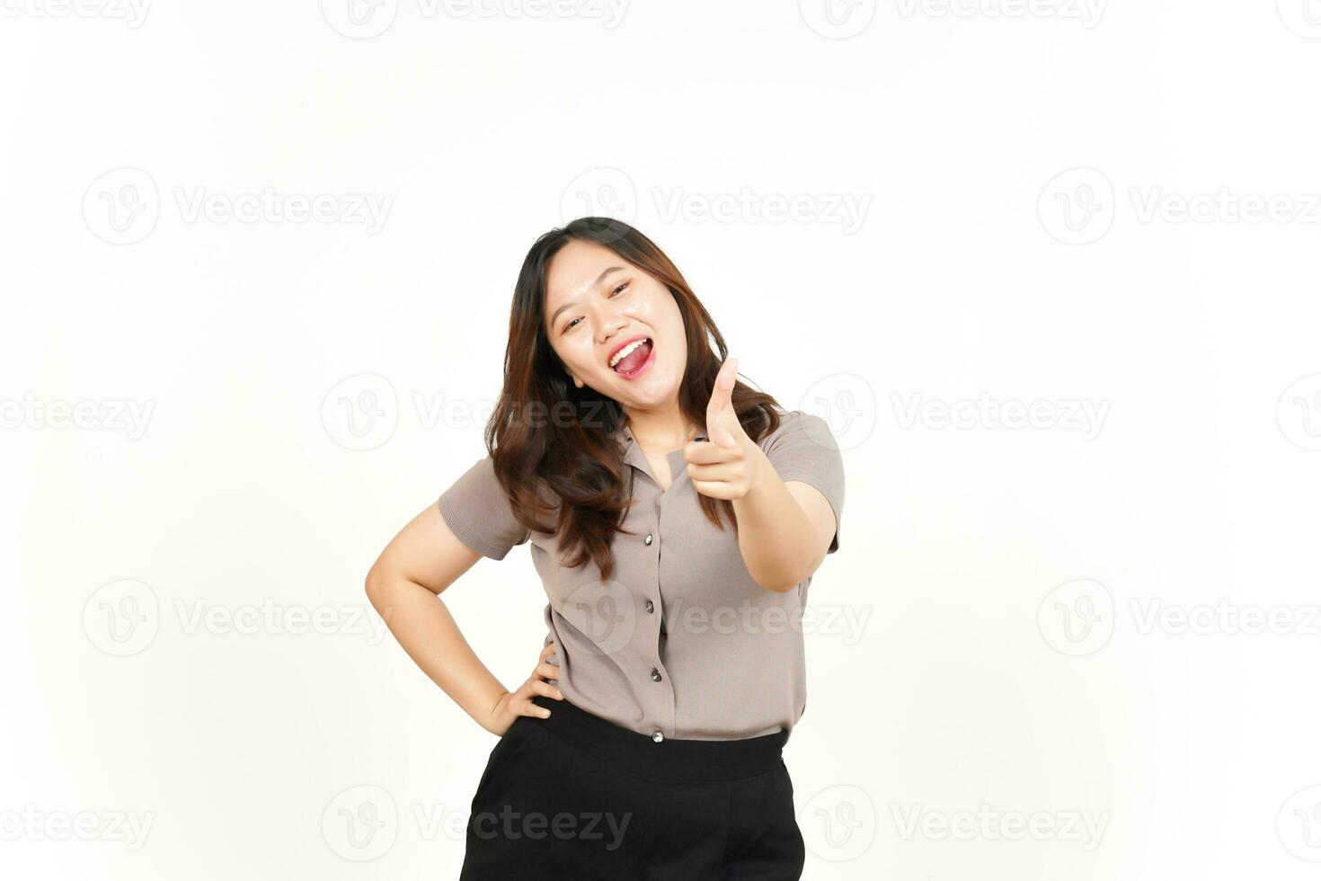 Smiling and Pointing at You, Want You Gesture Of Beautiful Asian Woman Isolated On White Background photo