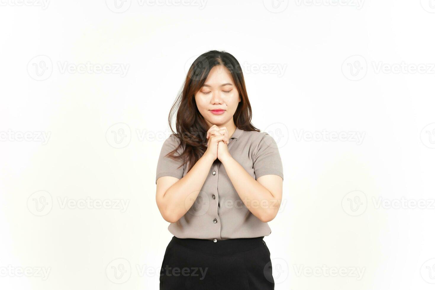 Folding hand and praying Of Beautiful Asian Woman Isolated On White Background photo