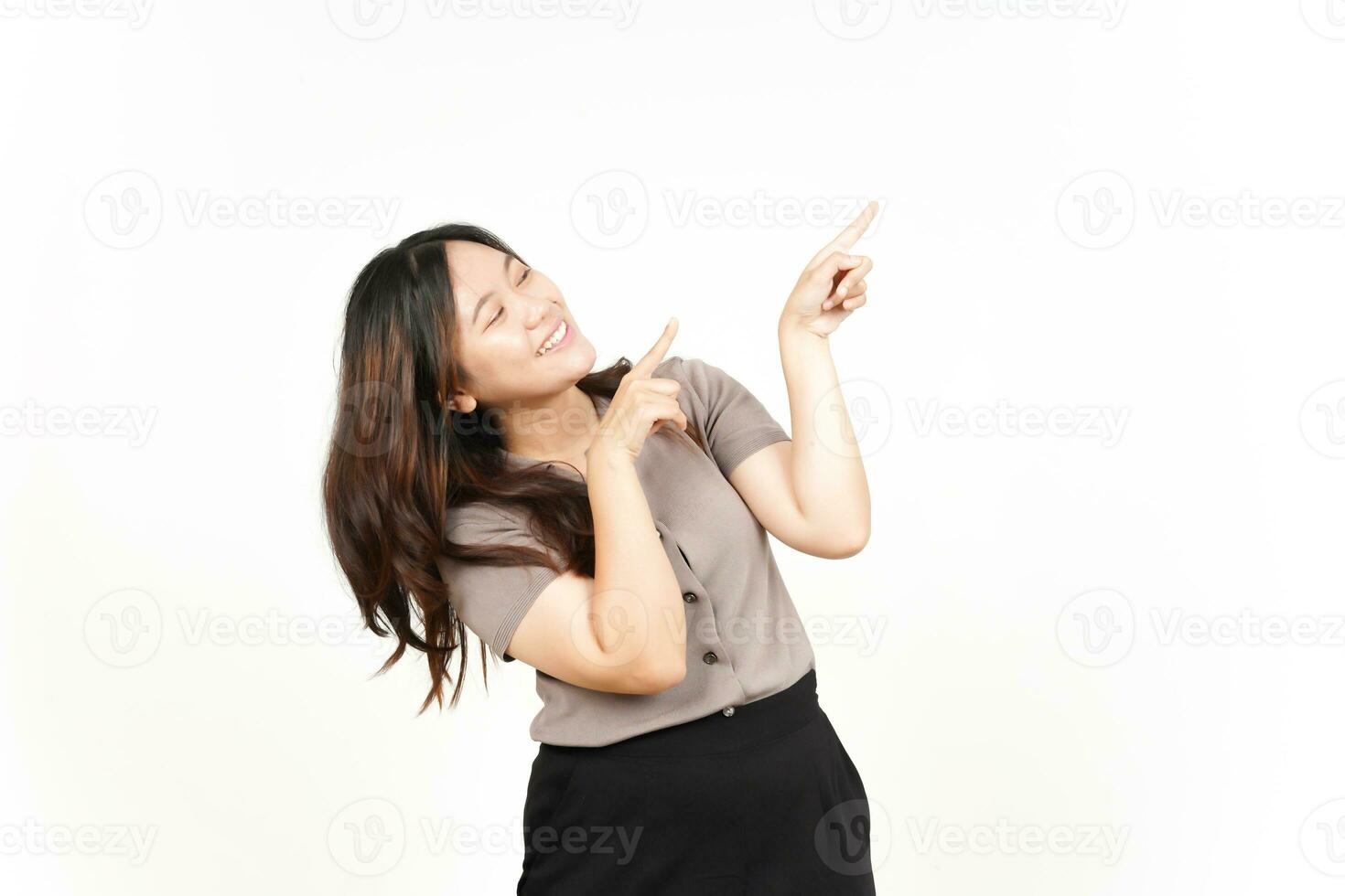 Showing Product and Pointing Blank Side using forefinger Of Beautiful Asian Woman Isolated On White Background photo