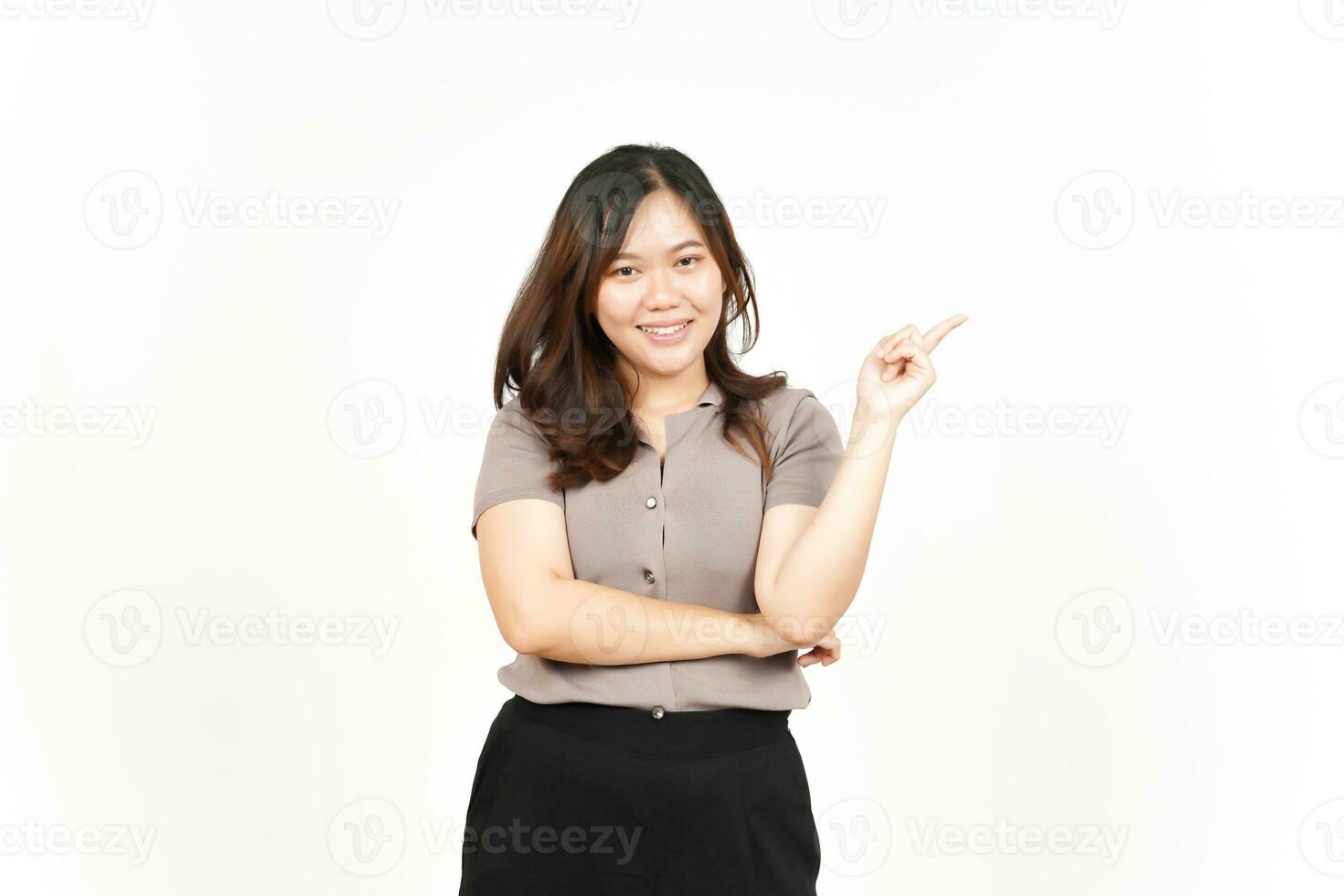 Showing Product and Pointing Blank Side using forefinger Of Beautiful Asian Woman Isolated On White photo