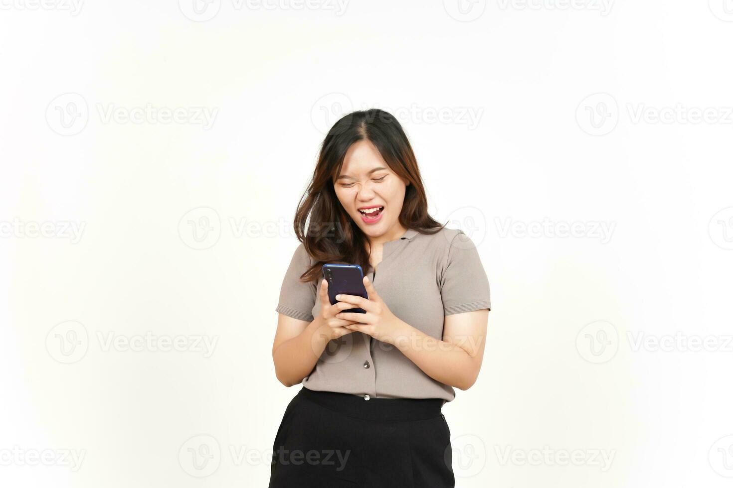 Shocked Face Holding and Using Smartphone Of Beautiful Asian Woman Isolated On White Background photo