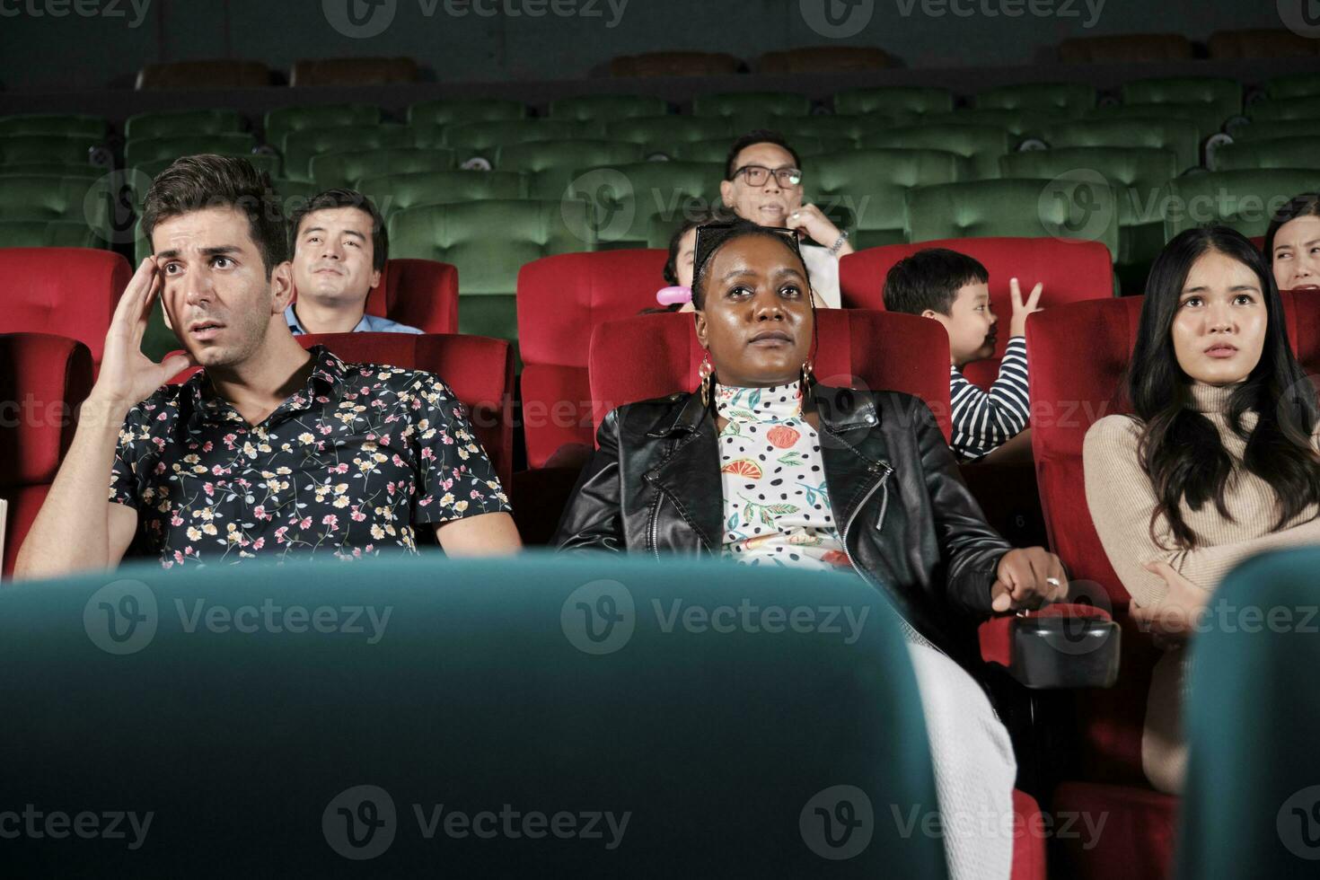 Various people in theater. Multiracial audiences, Black woman, and friends watching dramatic cinema and sad emotional expressions together on movie shows ending, entertainment lifestyle with film. photo