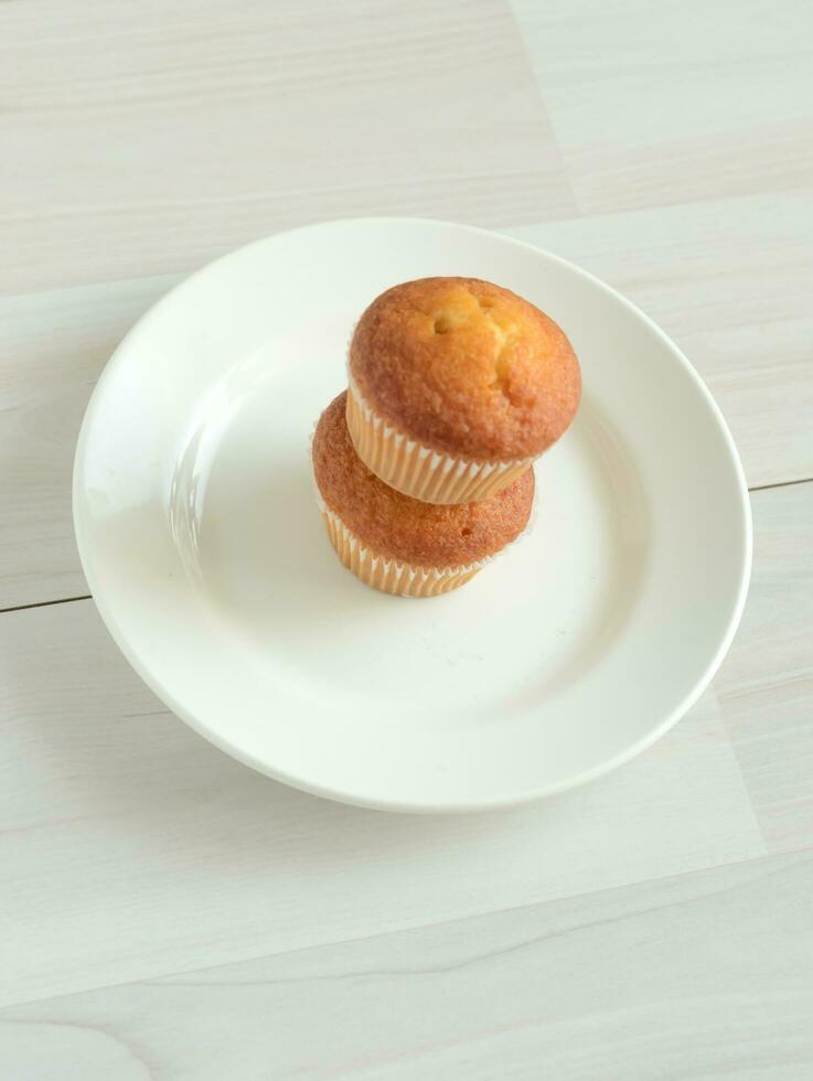 Two muffins on a plate. photo