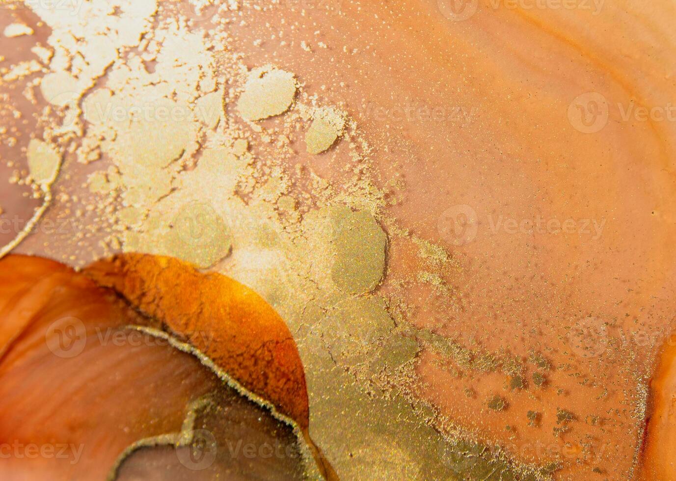 Abstract gold Desert background with beautiful smudges and wave textures, stains splashes made with alcohol ink. Gold fluid texture resembles space, stone, smoke, watercolor photo