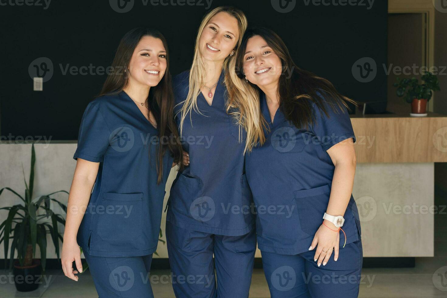 Beautiful smiling female health care workers looking at the camera. photo