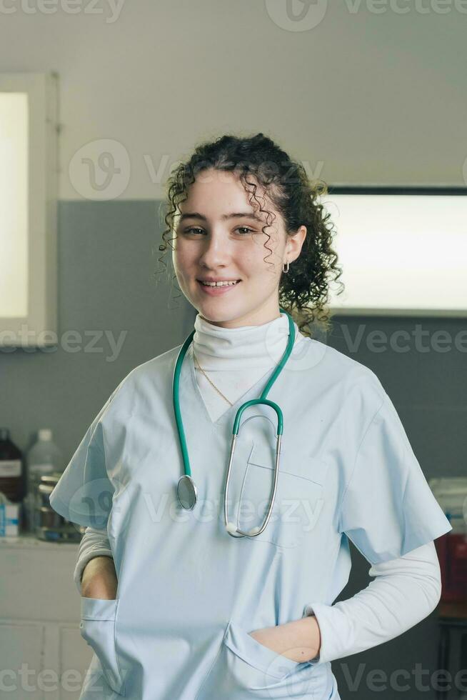 Medical student. Woman hospital worker looking at camera and smiling. photo