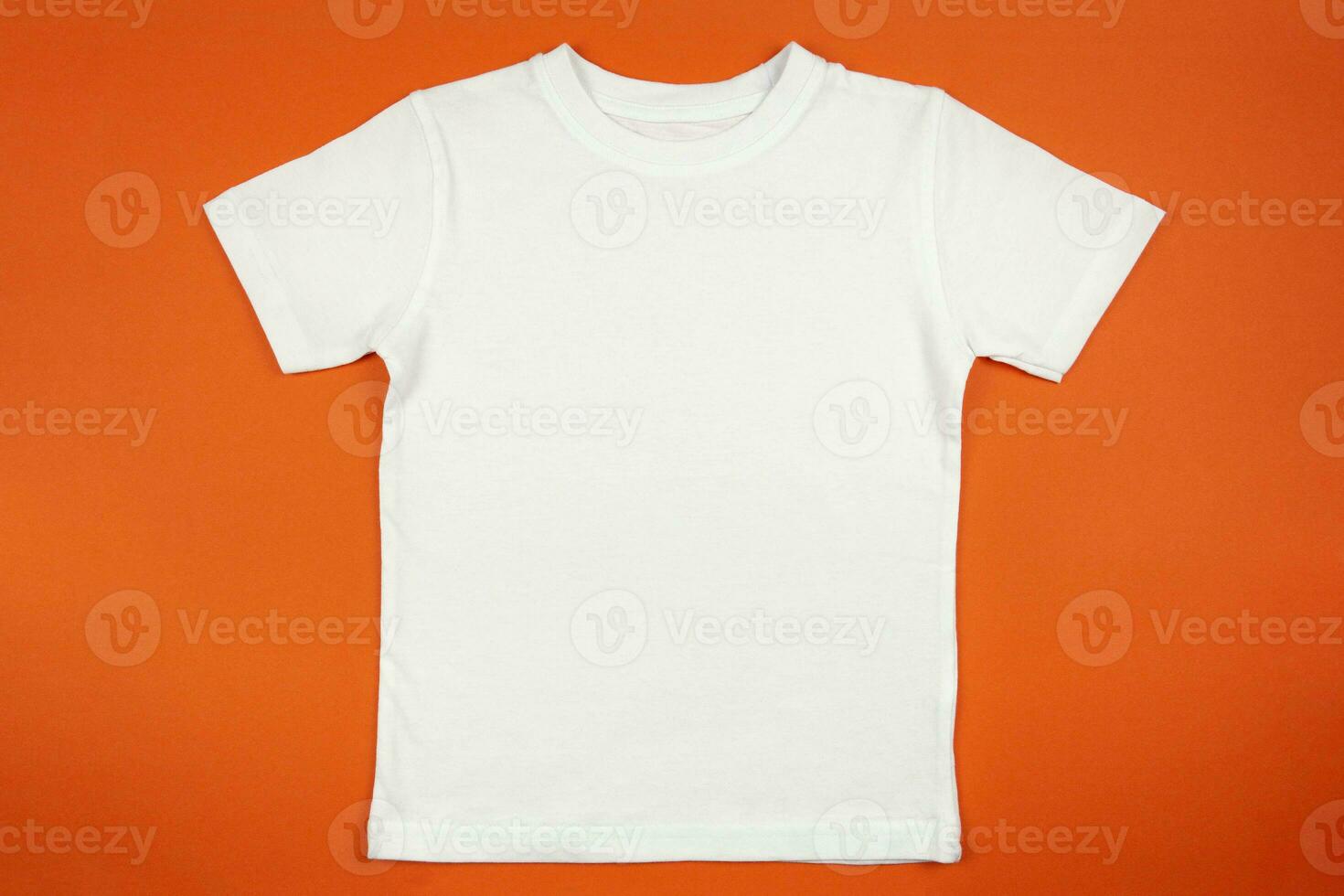 White womens cotton tshirt mockup on orange background. Design t shirt template, print presentation mock up. Top view flat lay. photo