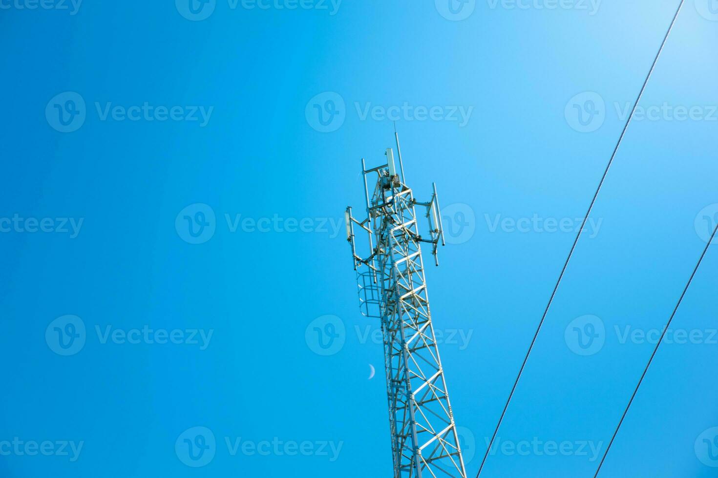 Antenna telecommunications and cable on moon and clear sky background,Beautiful gradient sky and clouds with sunrise,Concept of communication and data transmission,future 5G wireless,view from below. photo