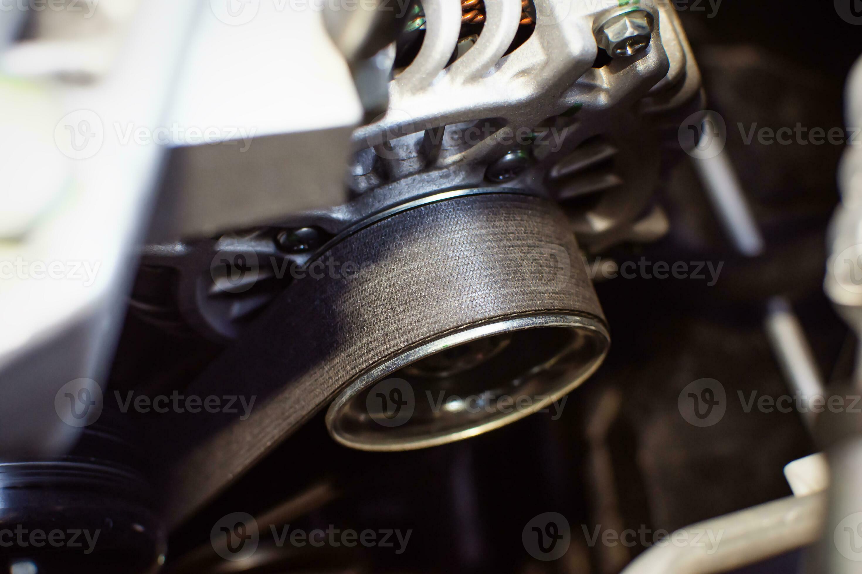 Timing belt of alternator or generator in car engine compartment