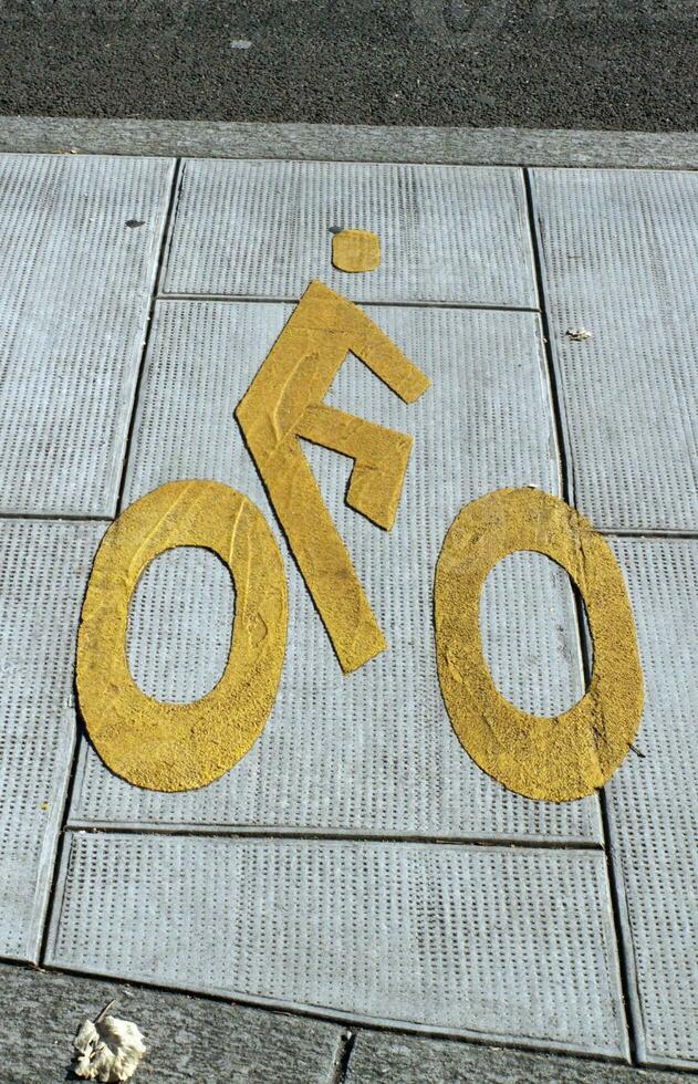 Bicycle sign path on the pavement photo