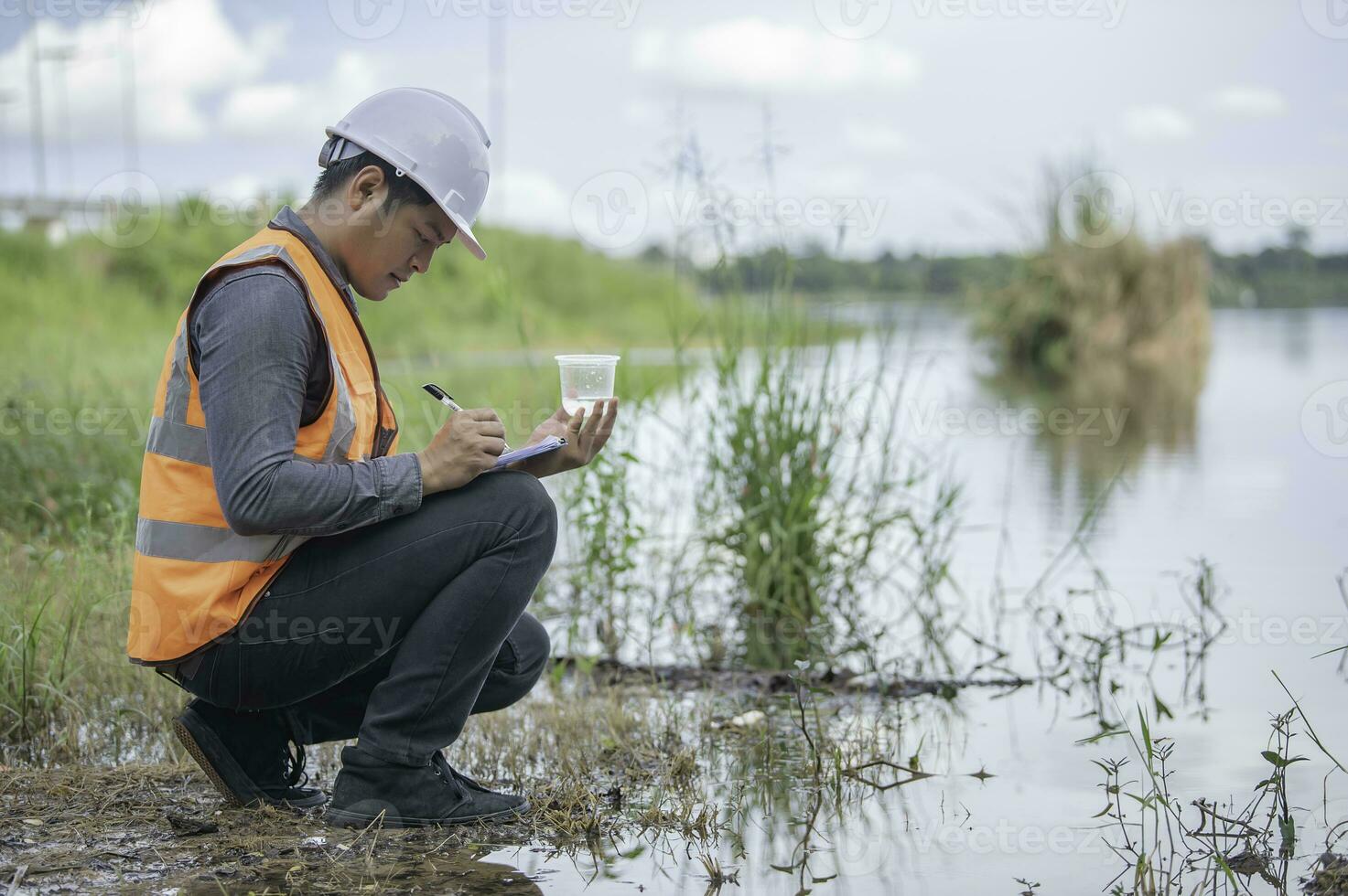 Environmental engineers inspect water quality,Bring water to the lab for testing,Check the mineral content in water and soil,Check for contaminants in water sources. photo