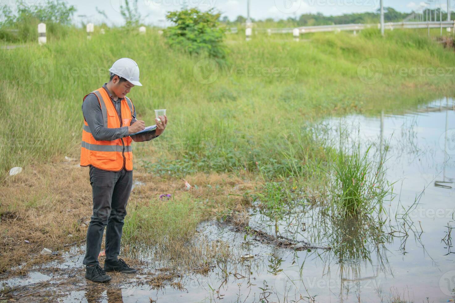 Environmental engineers inspect water quality,Bring water to the lab for testing,Check the mineral content in water and soil,Check for contaminants in water sources. photo