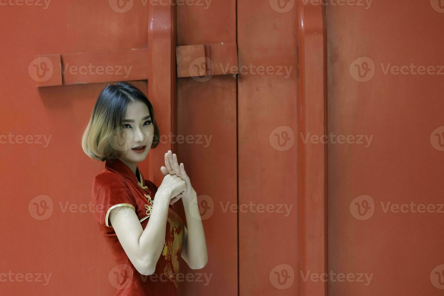 Portrait beautiful asian woman in Cheongsam dress,Thailand people,Happy Chinese new year concept,Happy  asian lady in chinese traditional dress photo