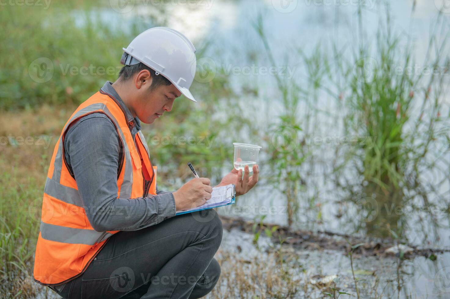 Environmental engineers inspect water quality,Bring water to the lab for testing,Check the mineral content in water and soil,Check for contaminants in water sources. photo