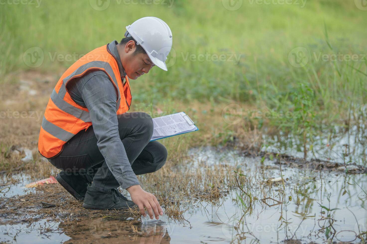 Environmental engineers inspect water quality,Bring water to the lab for testing,Check the mineral content in water and soil,Check for contaminants in water sources. photo