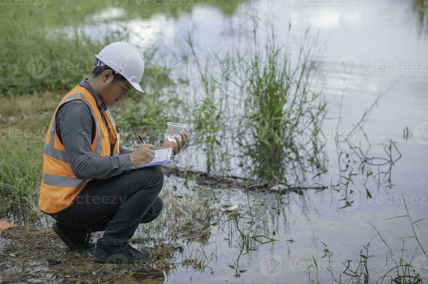 Environmental engineers inspect water quality,Bring water to the lab for testing,Check the mineral content in water and soil,Check for contaminants in water sources. photo