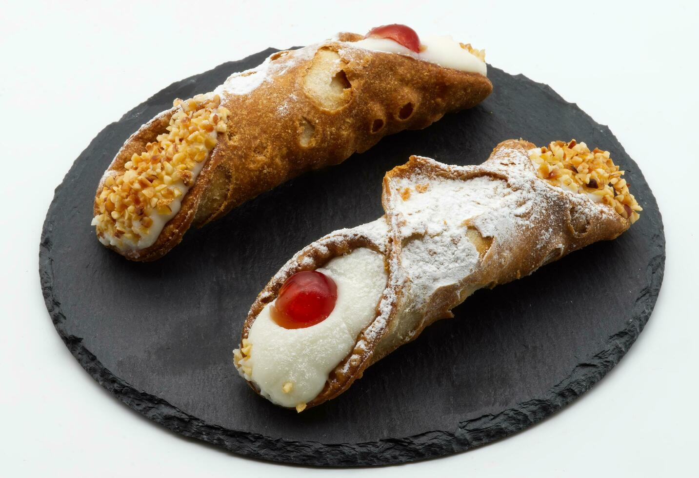 Sweet Sicilian cannoli filled with ricotta cream. Traditional Sicilian Italian dessert photo