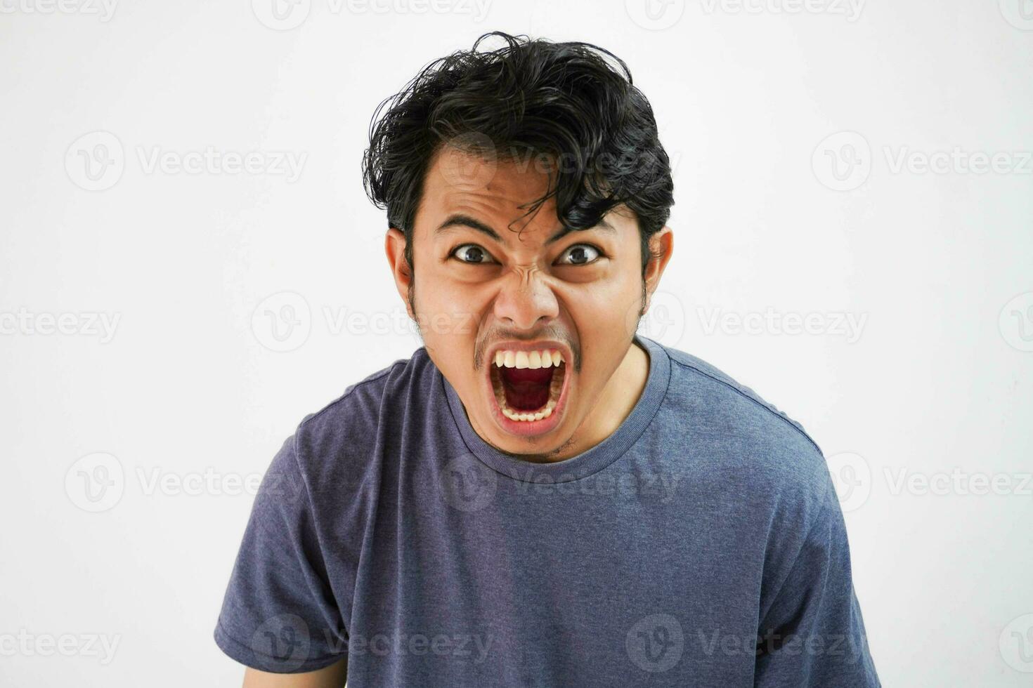 Handsome asian young man angry man screaming , shouting out loud isolated on white background photo