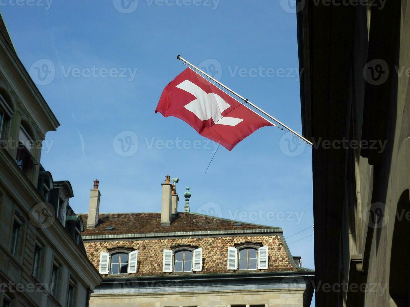 Swiss flag in old town, Geneva photo
