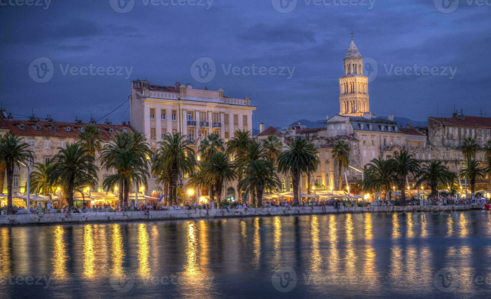 Riva waterfront, houses and Cathedral of Saint Domnius, Dujam, Duje, bell tower Old town by night, Split, Croatia, HDR photo