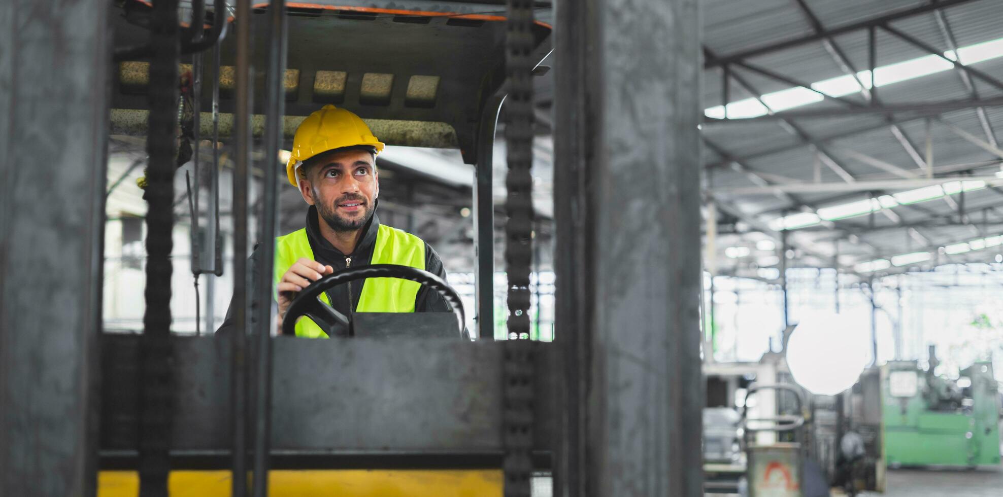 worker wearing helmet with driver forklift in warehouse photo