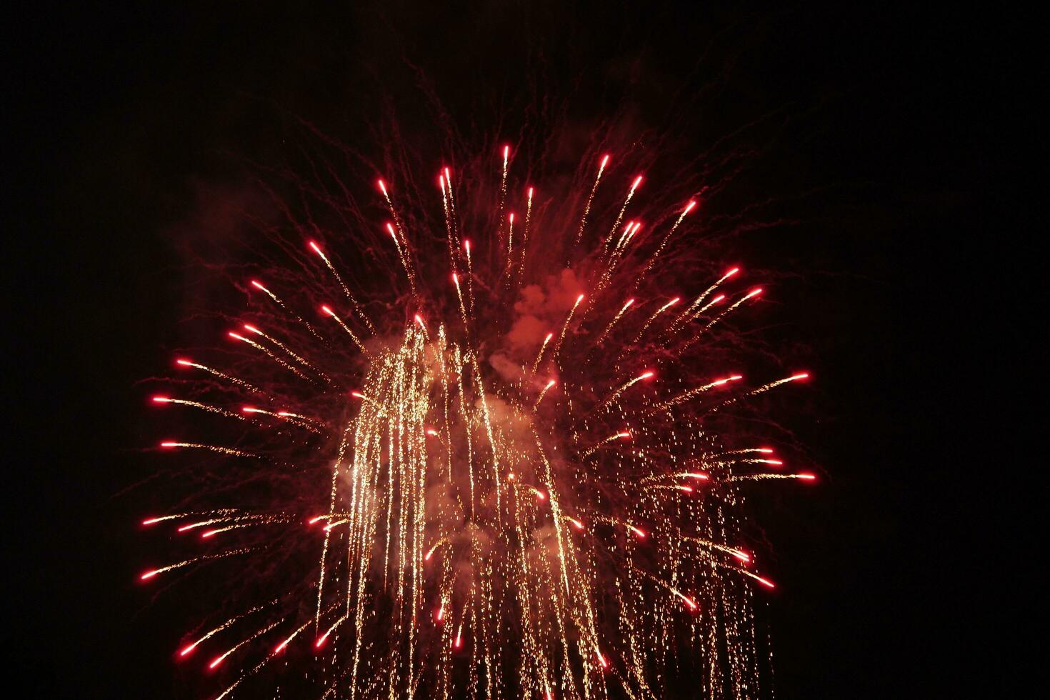 a large firework in the night sky photo