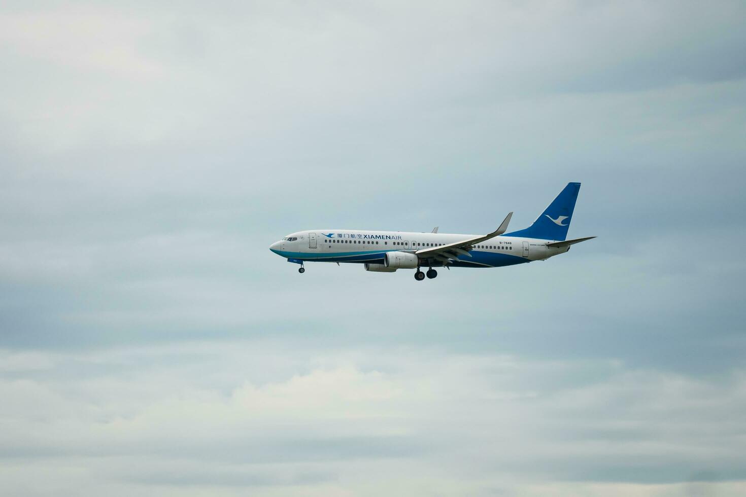 Bangkok, Thailand - August 26, 2023  Xiamen airlines prepare for Landing at Suvarnabhumi Airport, Thailand photo