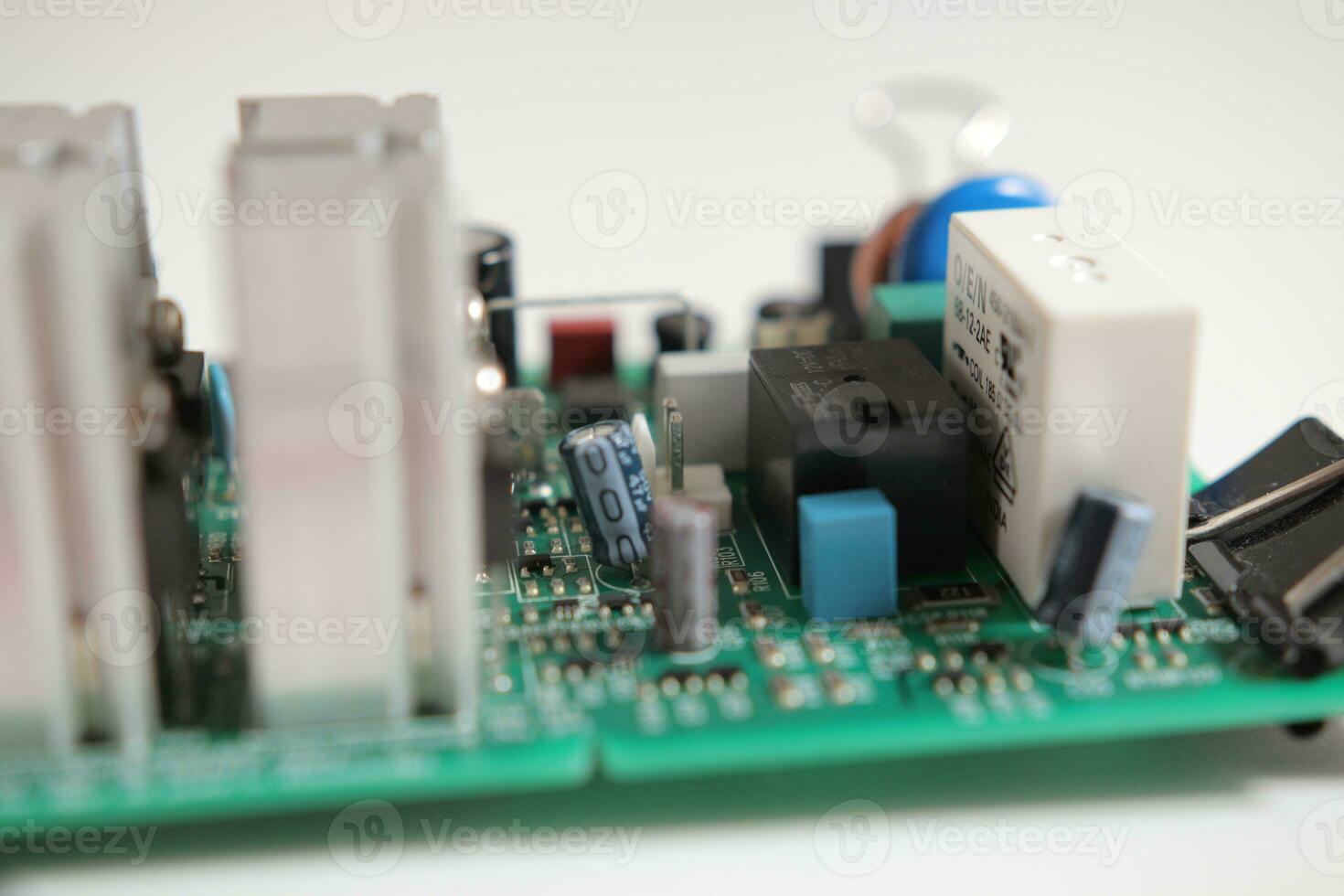 Power Supply modern printed-circuit board with electronic components with transistor. PCB detail photo