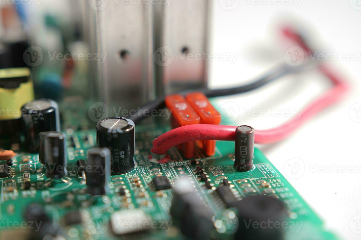 Power Supply modern printed-circuit board with electronic components with transistor. PCB detail photo