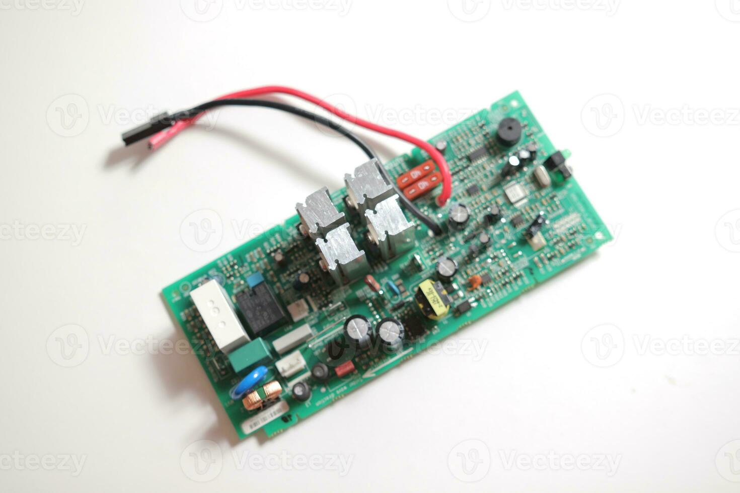 Power Supply modern printed-circuit board with electronic components with transistor. PCB detail photo