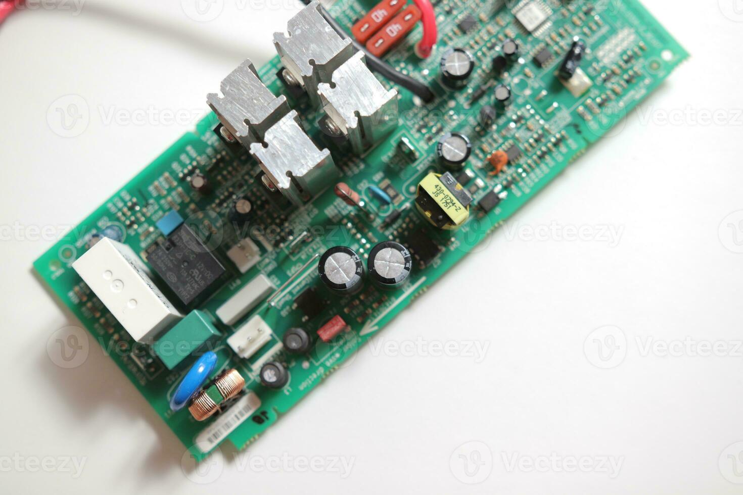 Power Supply modern printed-circuit board with electronic components with transistor. PCB detail photo