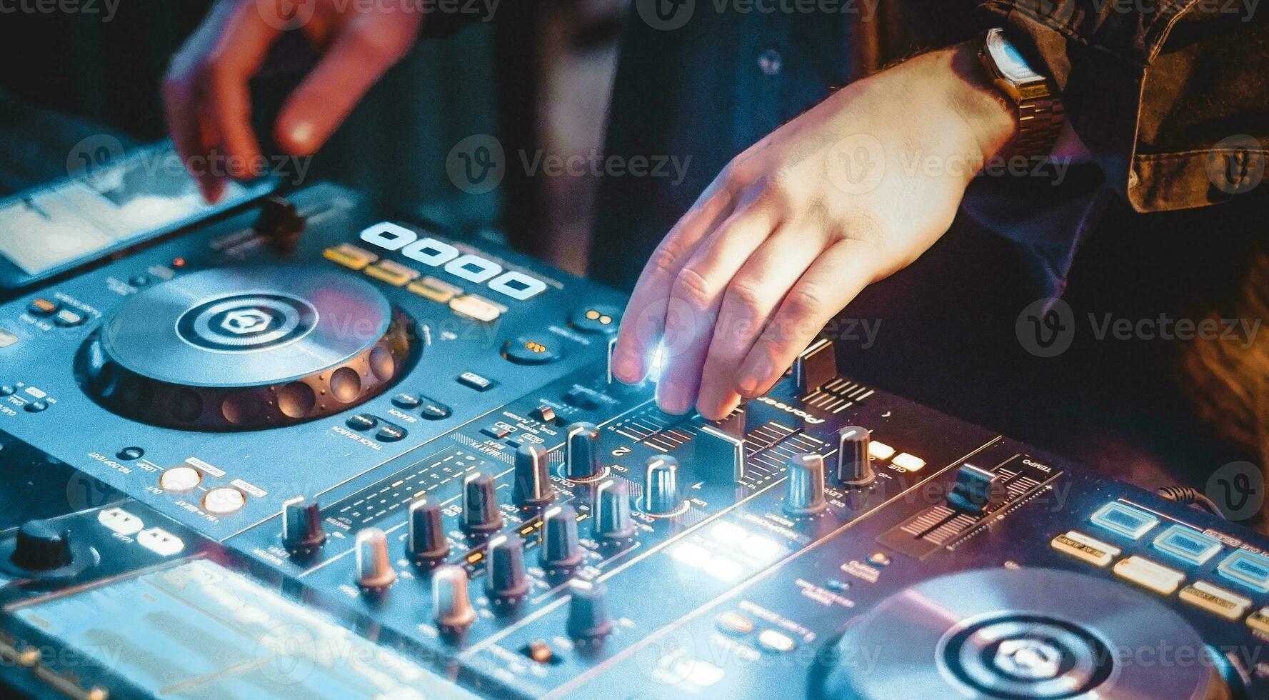 Dj performance with electronic music in the night club photo