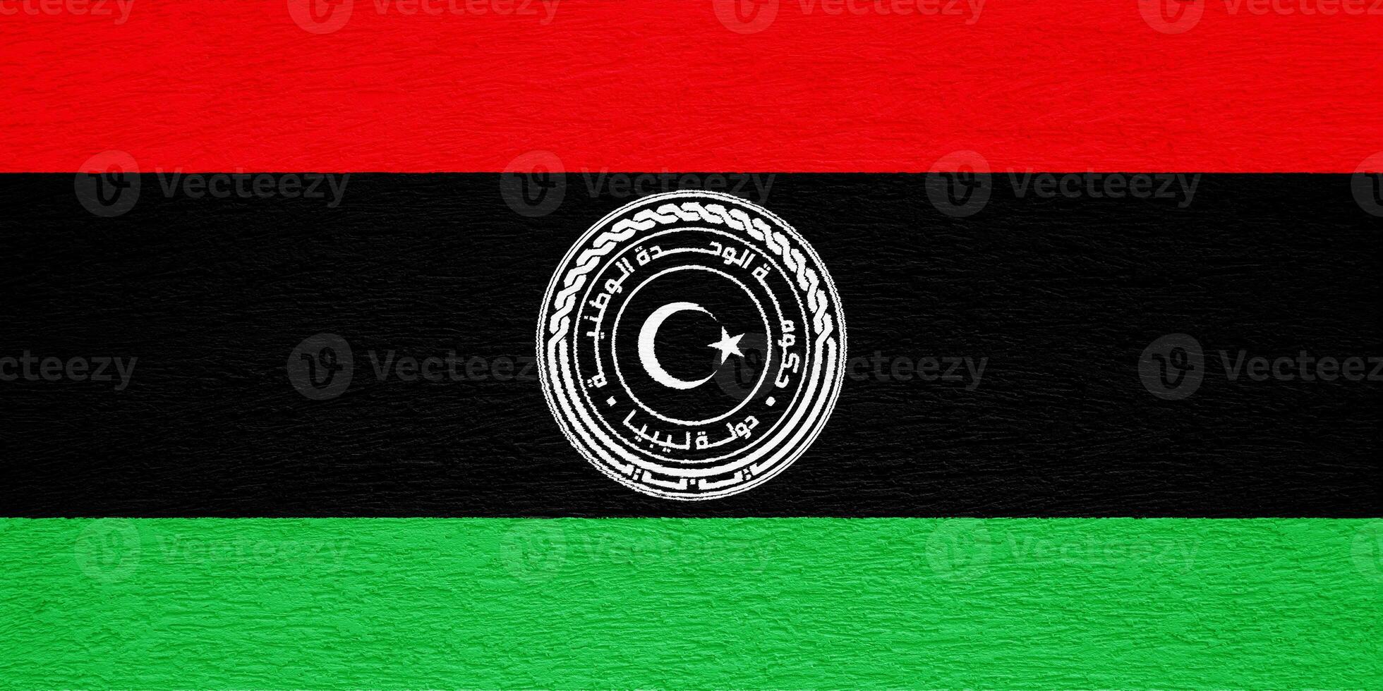 Flag and coat of arms of State of Libya on a textured background. Concept collage. photo