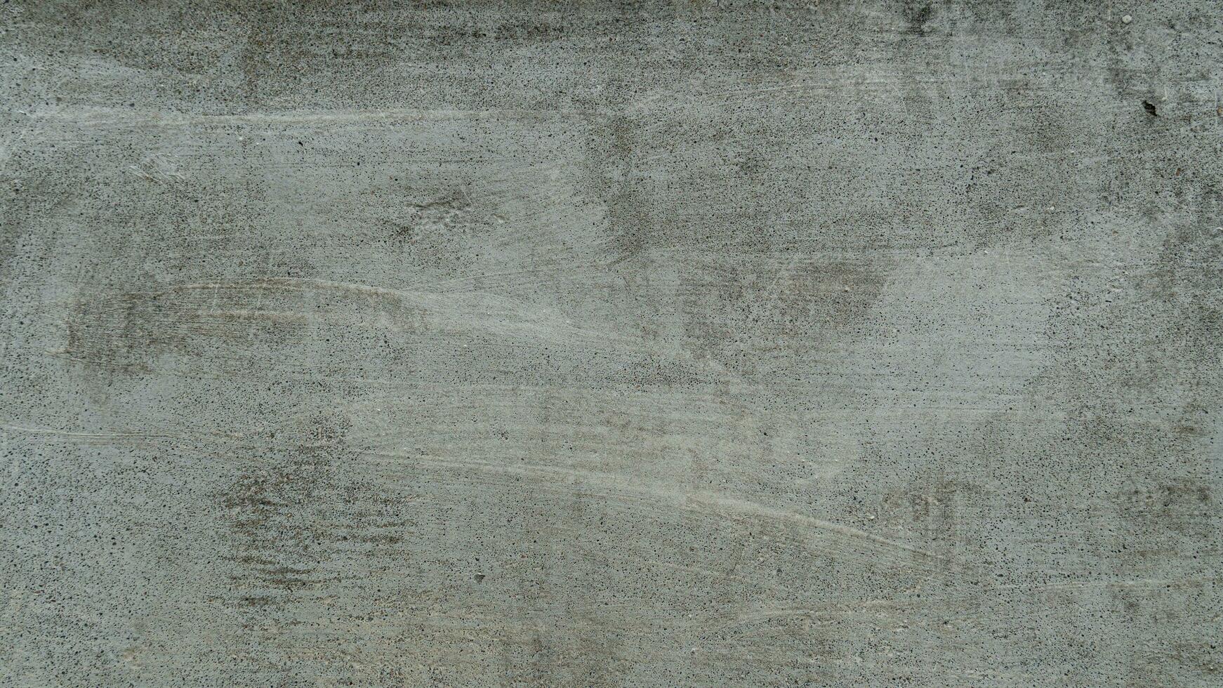 Background and textured above view of cement wall light gray color. Cement surface with old plaster floats. There are fine air bubbles floating in groups.Old floor with black mold sporadic. photo
