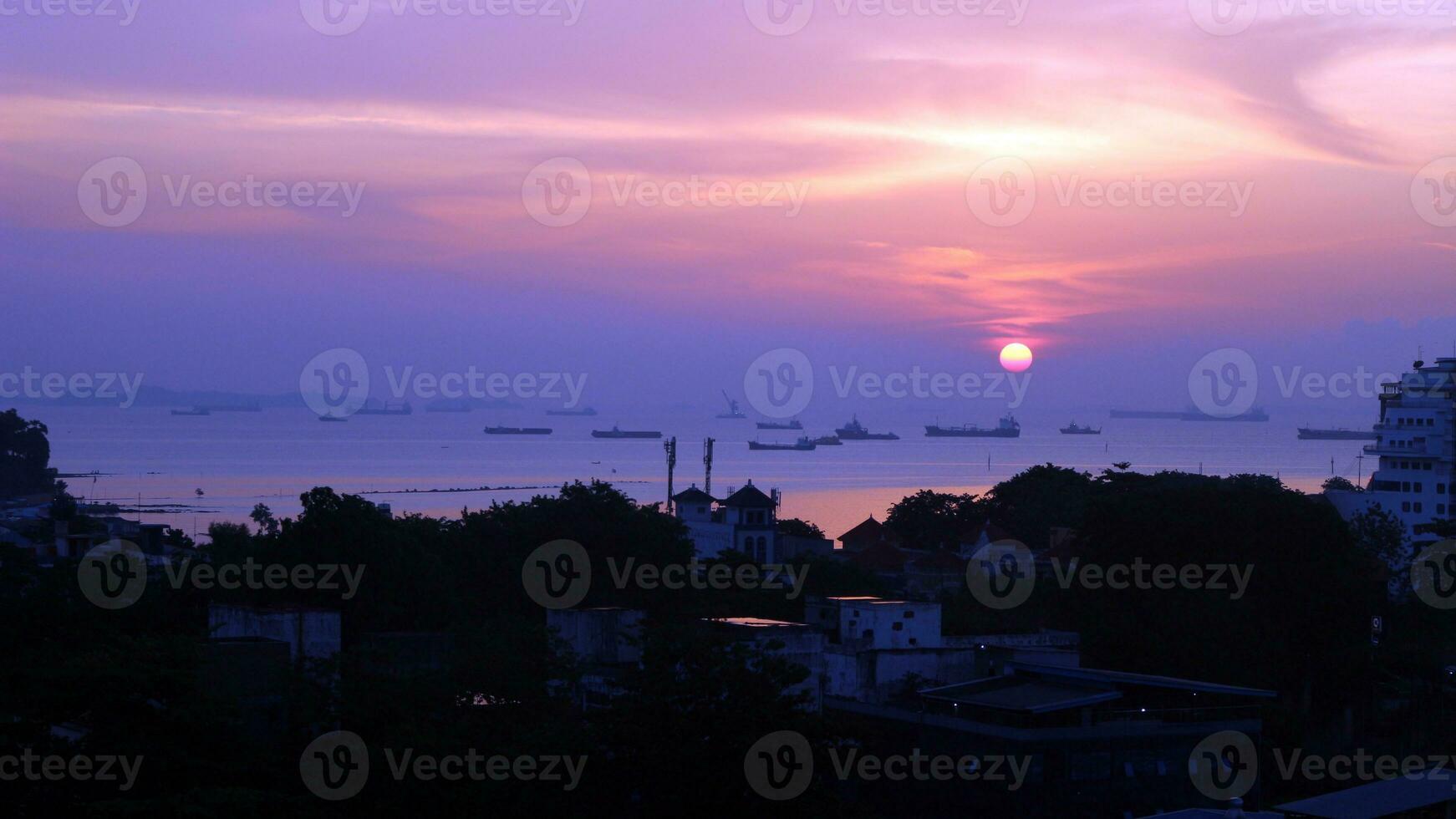 View of the sunset from the top of the building photo